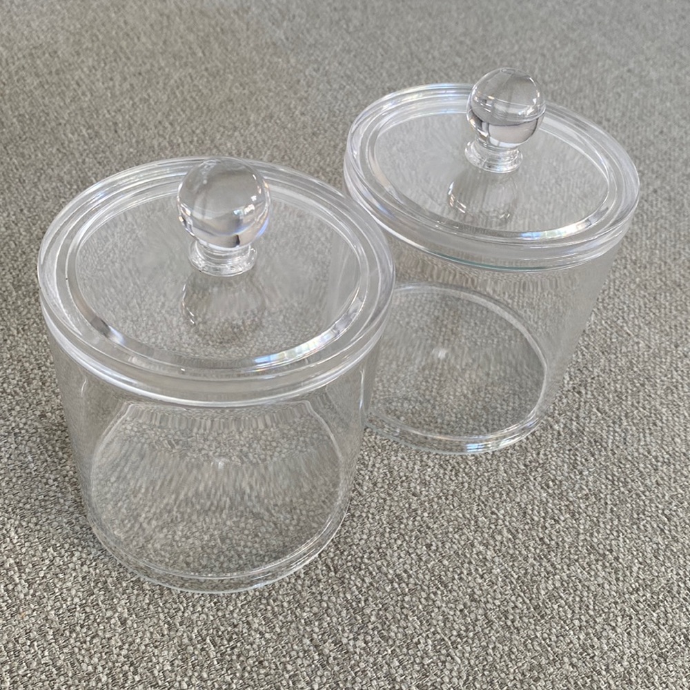 Set of 2 clear acrylic round storage box with lid. Used in good condition.